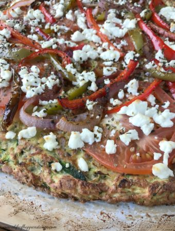 A healthy, low carb pizza crust made from zucchini, almond flour, eggs and oregano! Paleo, vegetarian, Whole 30 and SCD.