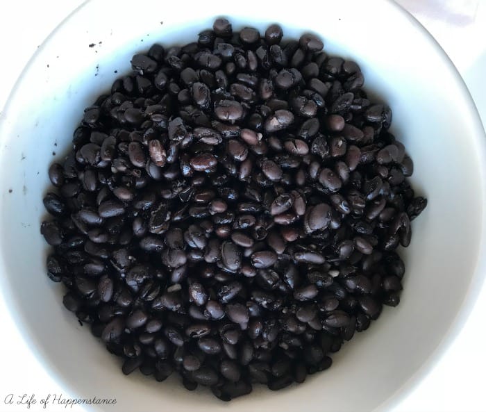 Close up of black beans in a white bowl