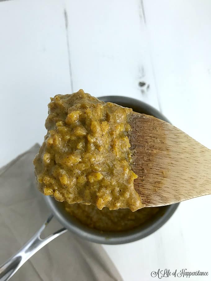 Paleo pumpkin oatmeal on a wooden spoon. 