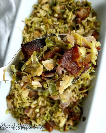 A spoonful of shaved brussels sprouts with bacon.