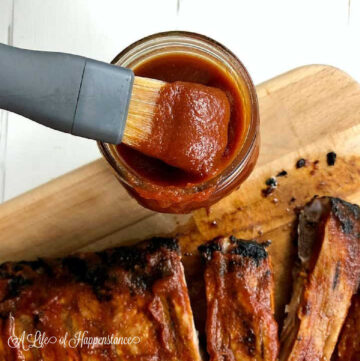A brush filled with homemade paleo bbq sauce.