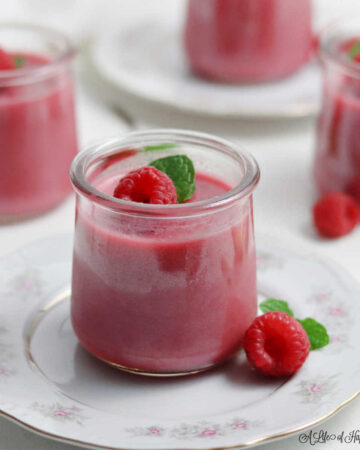 A small glass jar filled with panna cotta.