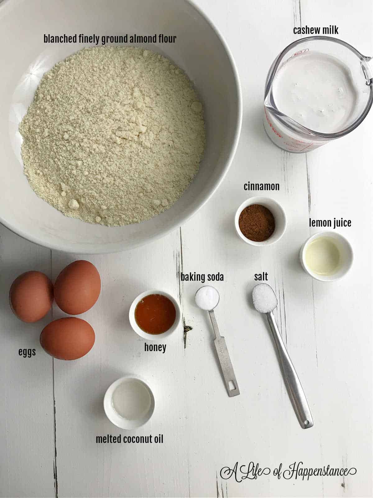 The ingredients for the pancakes on a white table. 