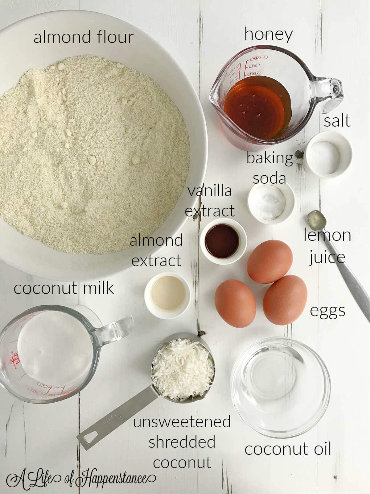 Ingredients for the coconut cake on a white table.