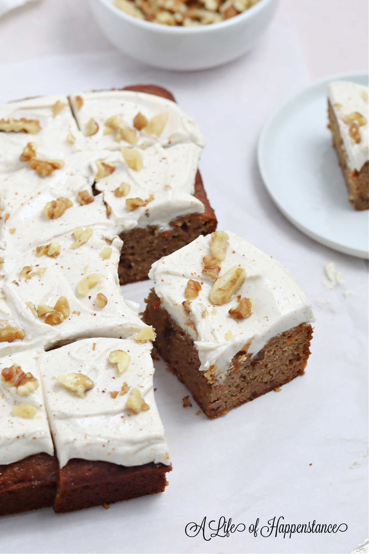 Sliced carrot cake on a table.