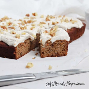 Sliced of almond flour carrot cake on white parchment paper.